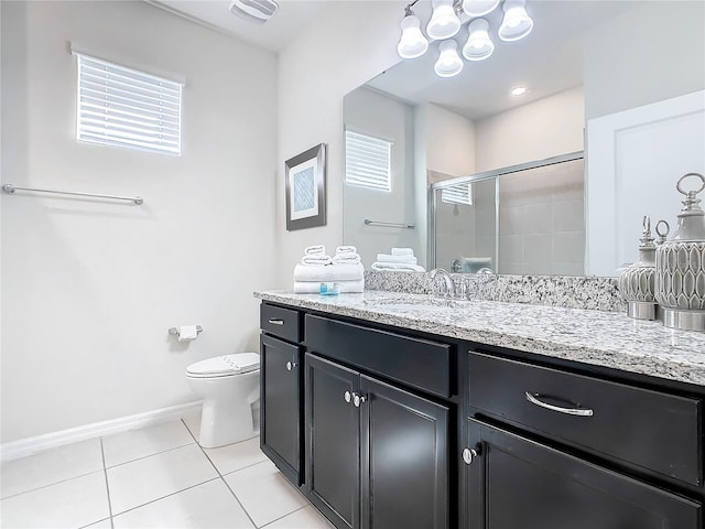 bathroom with vanity, an inviting chandelier, an enclosed shower, toilet, and tile patterned floors