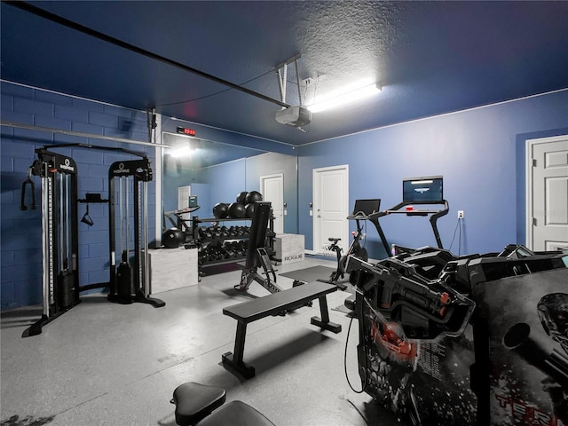 gym with a textured ceiling