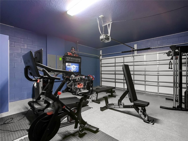 workout room featuring a textured ceiling