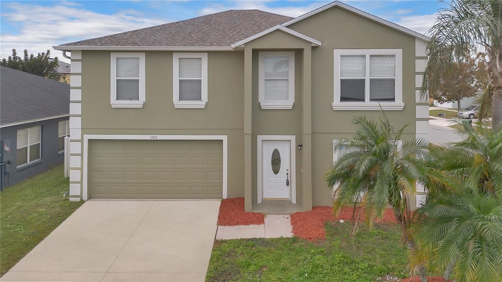 view of front of property with a garage