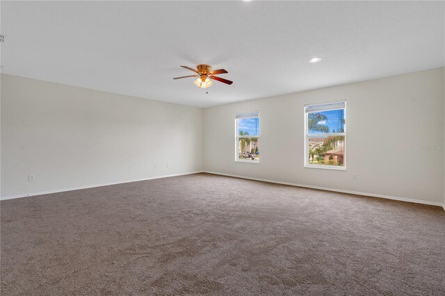 empty room featuring carpet and ceiling fan