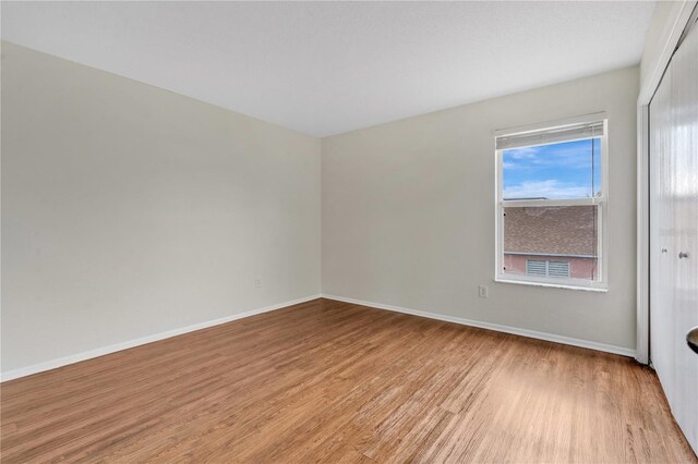 spare room with light hardwood / wood-style floors