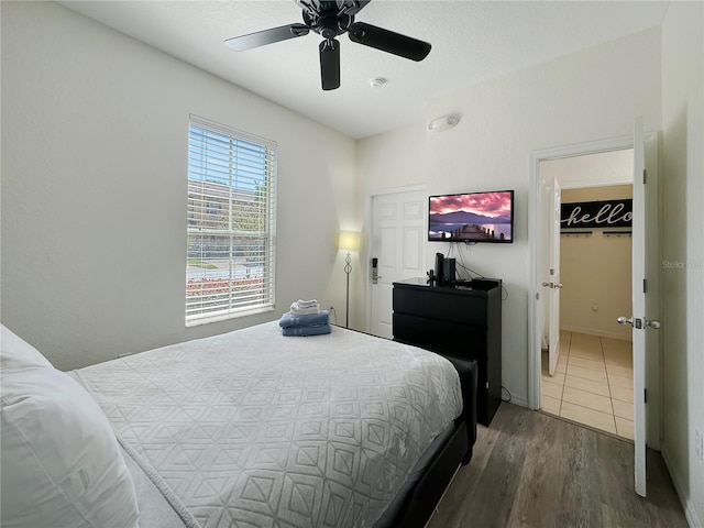 bedroom featuring dark hardwood / wood-style flooring and ceiling fan