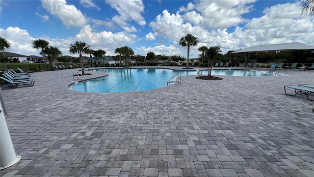 view of swimming pool featuring a patio