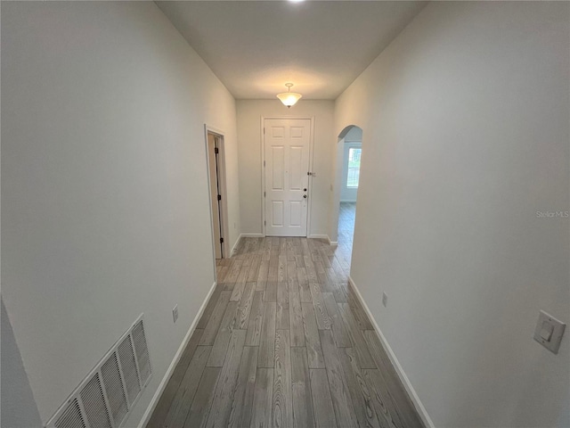 hallway with light wood-type flooring