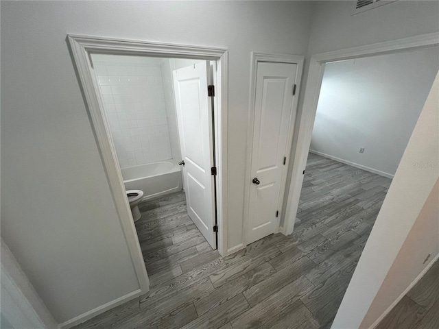 corridor featuring hardwood / wood-style flooring