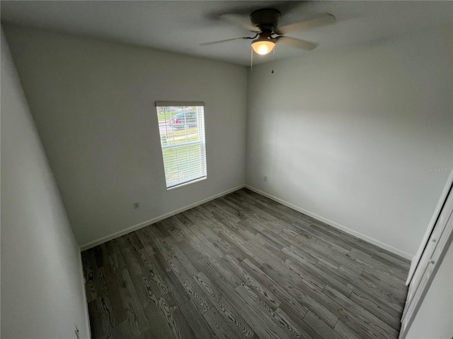 spare room featuring hardwood / wood-style flooring and ceiling fan