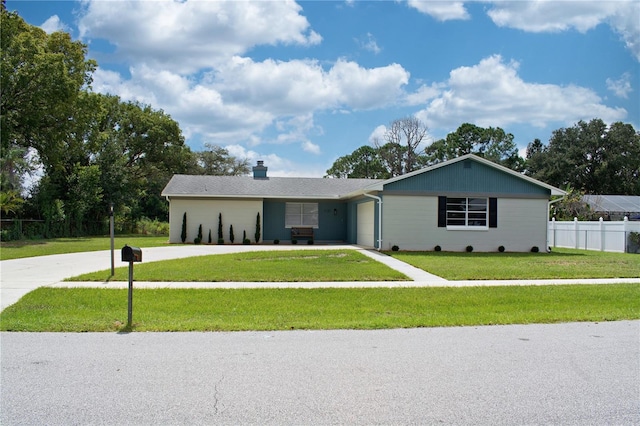 ranch-style house with a garage and a front yard