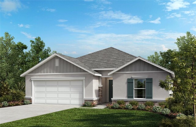 view of front of property with a front lawn and a garage