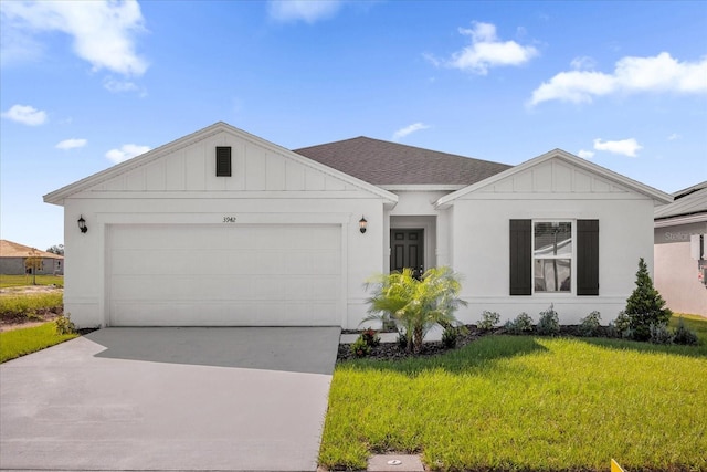 view of front of house featuring a front lawn and a garage