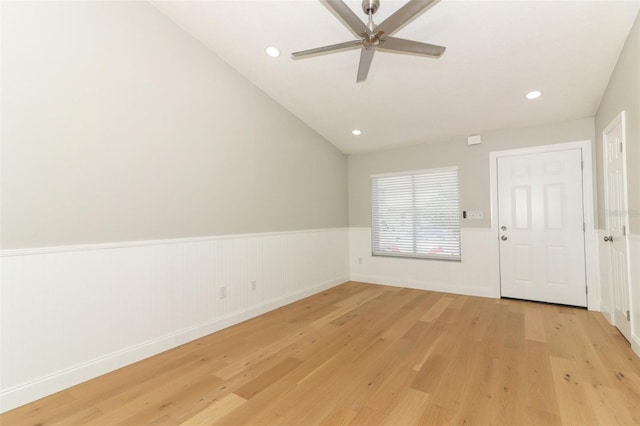 interior space with lofted ceiling, ceiling fan, and light hardwood / wood-style flooring