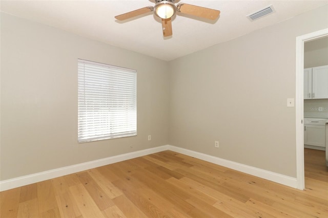 empty room featuring light wood-type flooring and ceiling fan