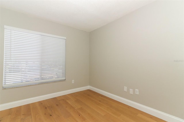 empty room featuring hardwood / wood-style flooring