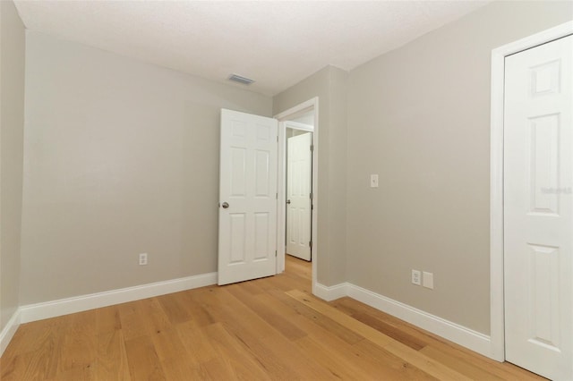 unfurnished room featuring light hardwood / wood-style floors