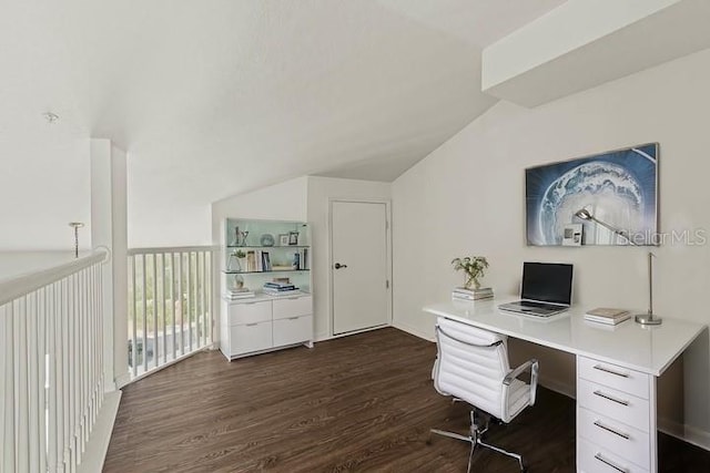 unfurnished office with vaulted ceiling and dark wood-type flooring