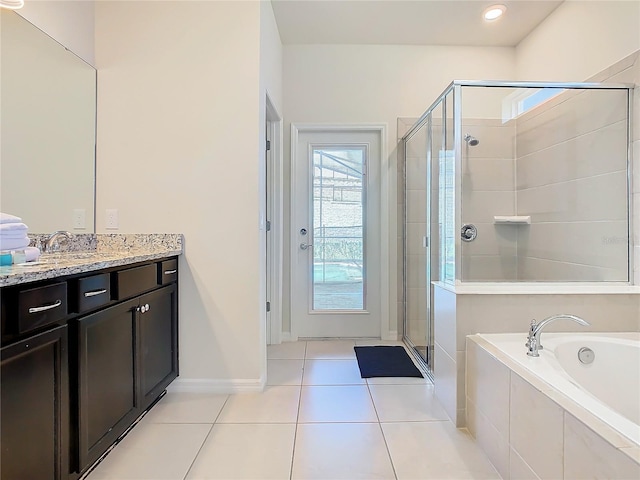 bathroom with vanity, plus walk in shower, and tile patterned floors