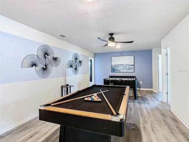 rec room with pool table, a textured ceiling, hardwood / wood-style floors, and ceiling fan