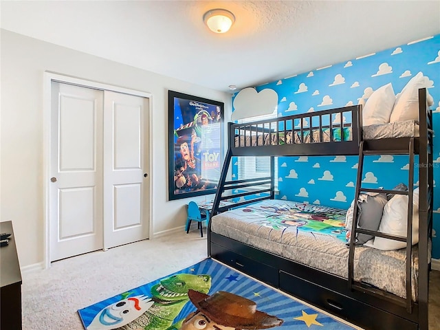 carpeted bedroom with a closet