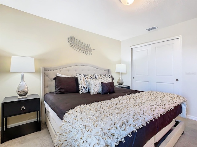 carpeted bedroom featuring a closet