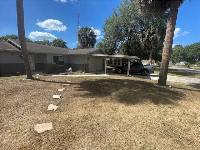 exterior space with a front yard and a carport