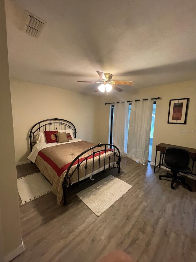 bedroom featuring ceiling fan and hardwood / wood-style floors