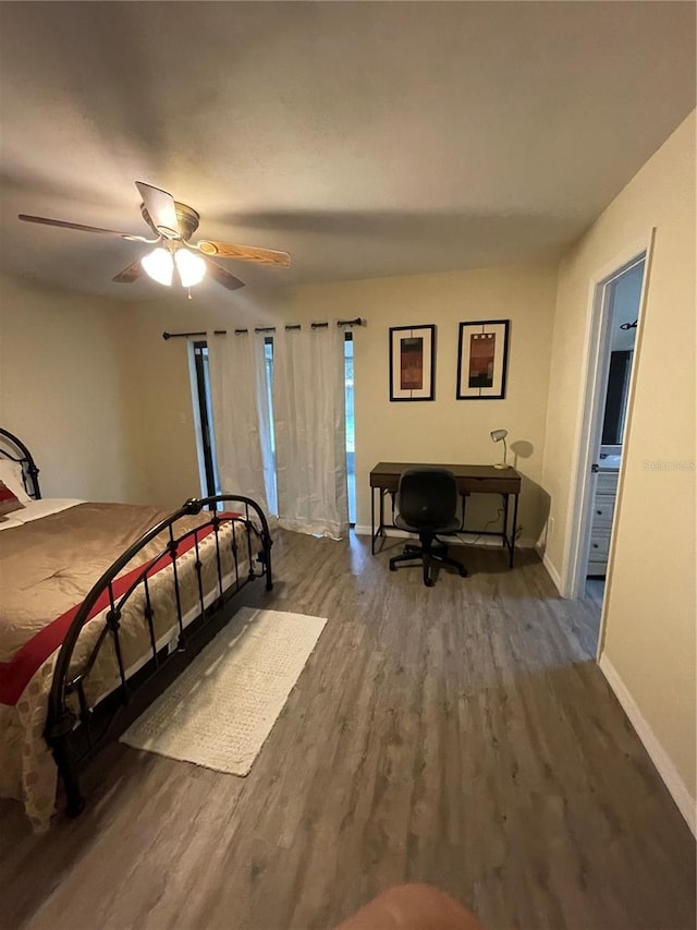 bedroom featuring dark wood-type flooring and ceiling fan