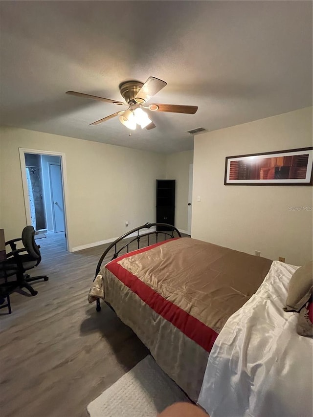 bedroom featuring ceiling fan and hardwood / wood-style flooring