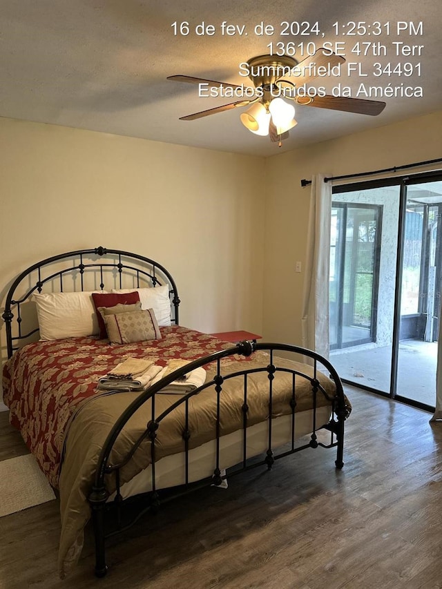 bedroom featuring access to outside, ceiling fan, and dark wood-type flooring