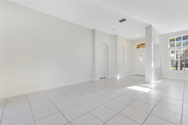 unfurnished room featuring light tile patterned floors