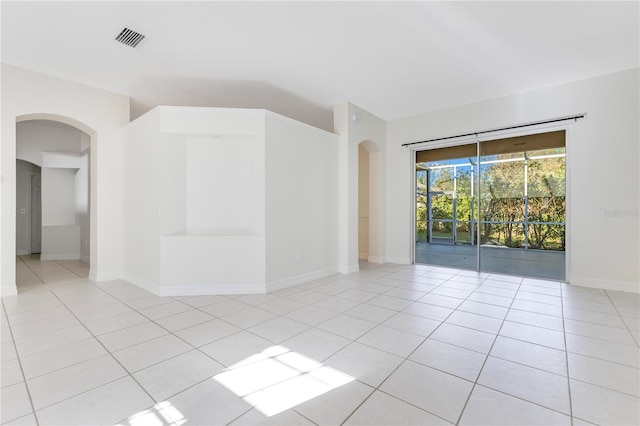 empty room featuring light tile patterned floors