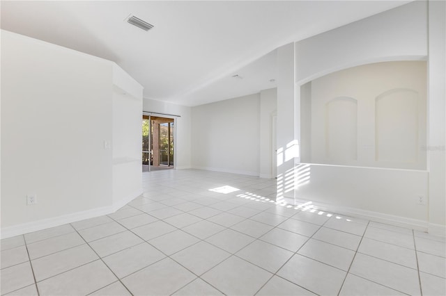 unfurnished room featuring light tile patterned flooring