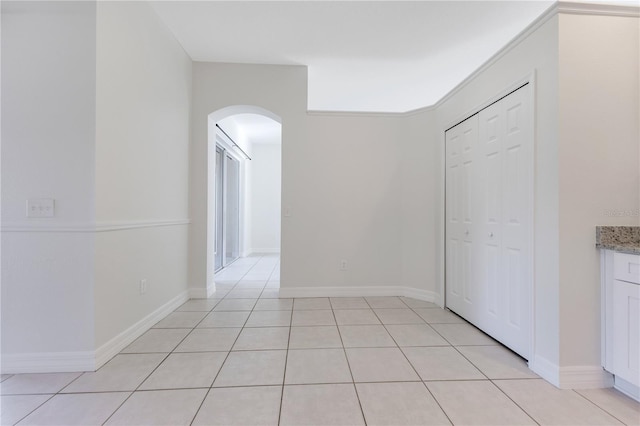 corridor featuring light tile patterned flooring