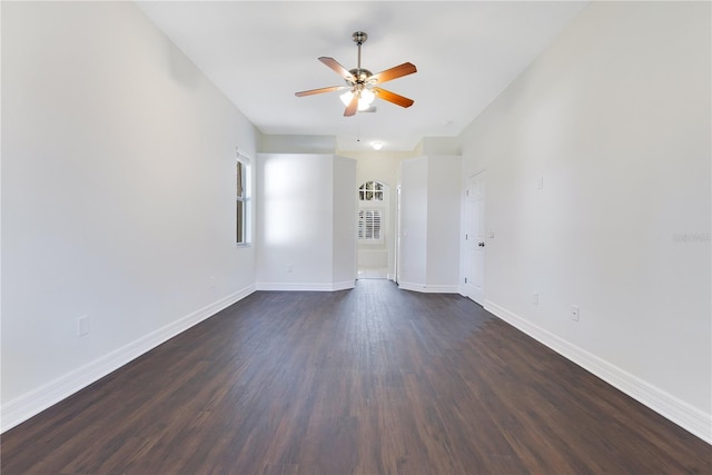 spare room with ceiling fan and dark hardwood / wood-style flooring