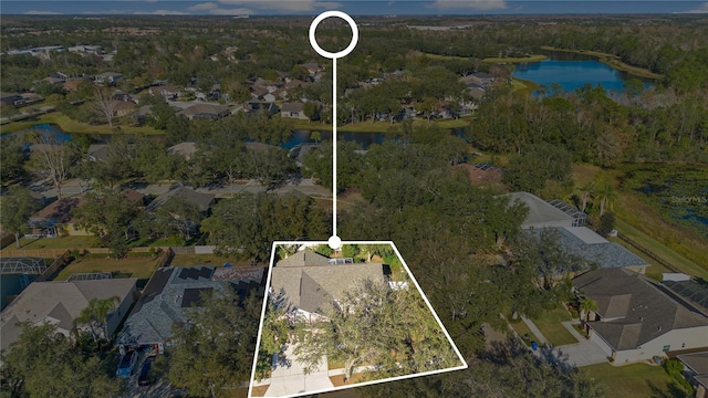 birds eye view of property featuring a water view