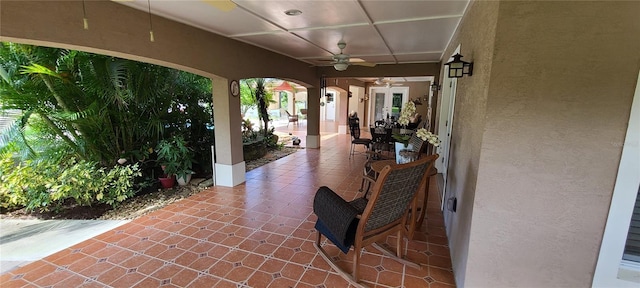 view of patio / terrace featuring ceiling fan and french doors