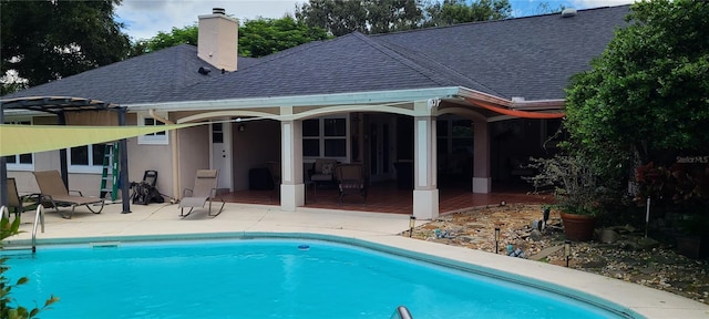 view of swimming pool featuring a patio area