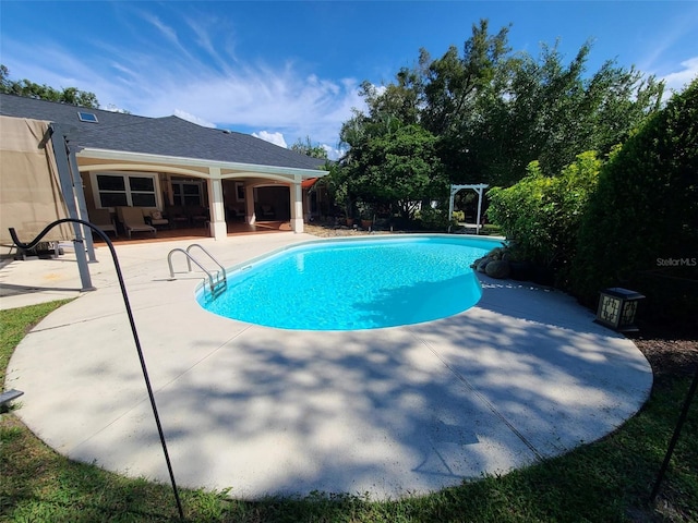 outdoor pool with a patio