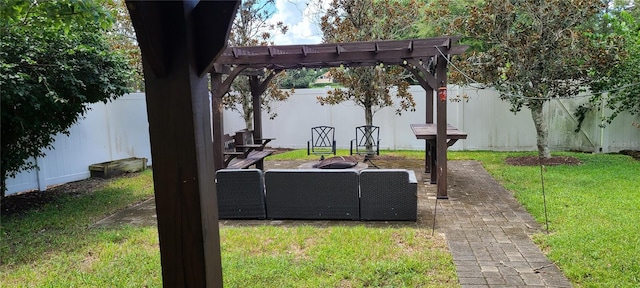 exterior space featuring a pergola and an outdoor fire pit