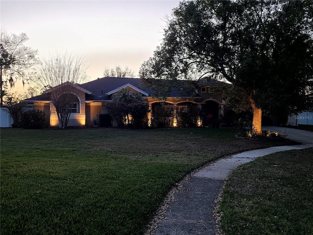 view of front of property with a front lawn