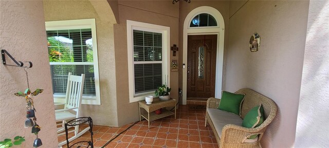 property entrance with stucco siding