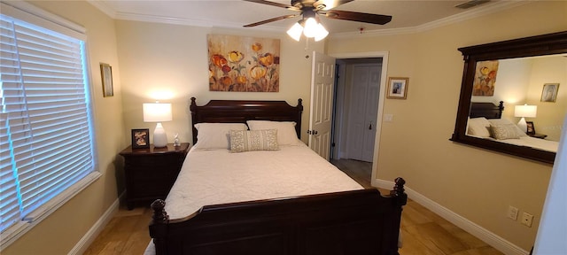 bedroom featuring light wood-style flooring, visible vents, and crown molding