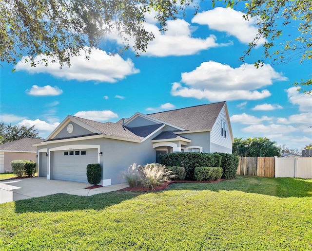 view of front facade with a garage and a front yard