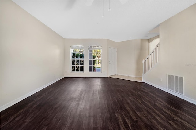 unfurnished living room with dark hardwood / wood-style floors