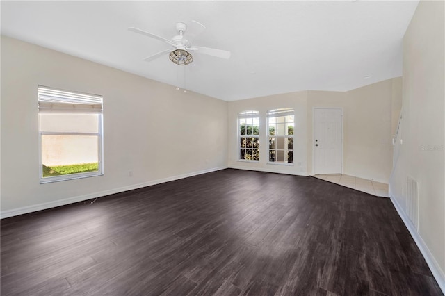 spare room featuring ceiling fan and dark hardwood / wood-style flooring