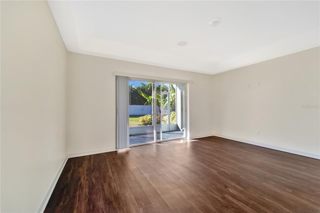 spare room featuring hardwood / wood-style floors