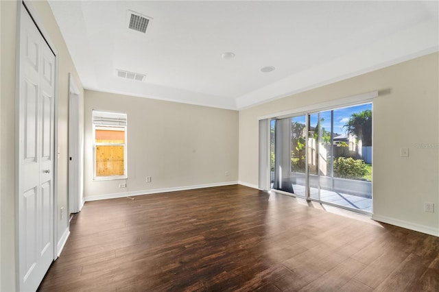 unfurnished room featuring dark hardwood / wood-style floors