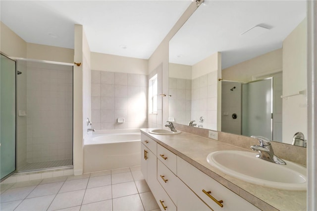 bathroom with shower with separate bathtub, vanity, and tile patterned floors