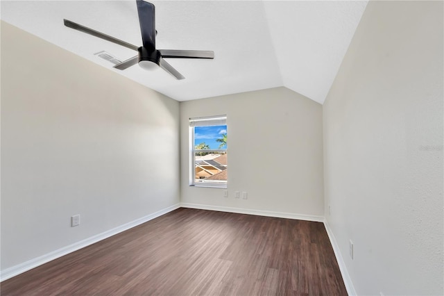 unfurnished room with ceiling fan, dark hardwood / wood-style flooring, and lofted ceiling