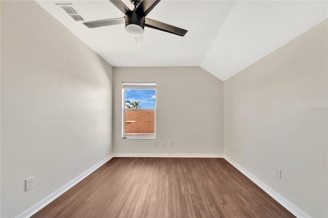 unfurnished room featuring dark hardwood / wood-style flooring, ceiling fan, and lofted ceiling