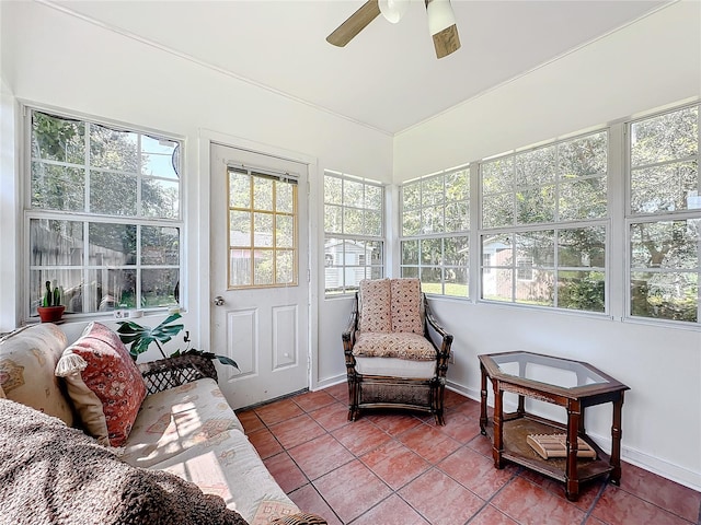 sunroom / solarium featuring ceiling fan